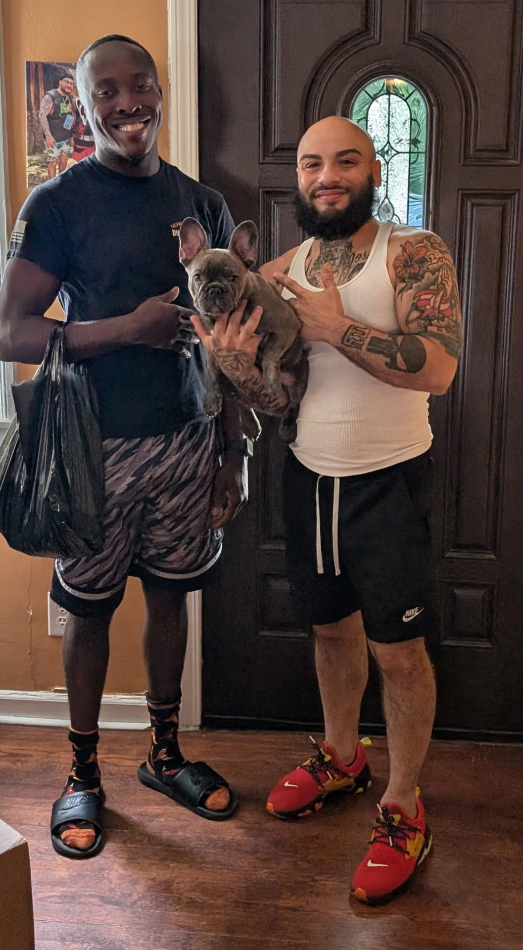 Happy customer picking up his new French Bulldog puppy