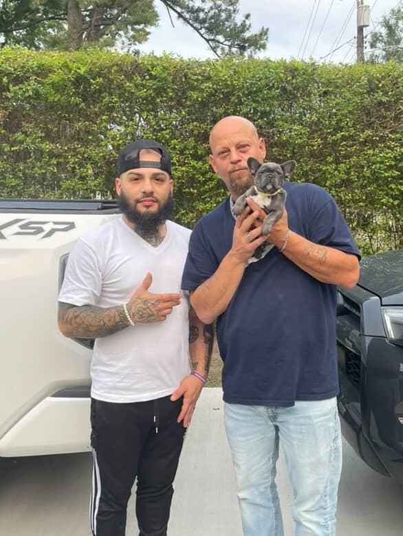 Puppy pickup day outside with a blue French Bulldog